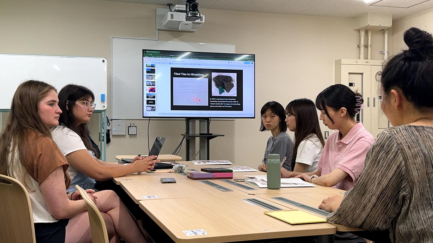 The NP team presenting their project to the Hiroshima undergraduate student partner at the EVRI. 